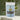 Wellness Brew in a soothing package with a mix of herbal ingredients and tea leaves in the background.